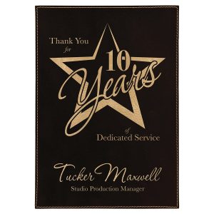 Black and gold leatherette plaque commemorating 10 years of dedicated service. Perfect for awards an.